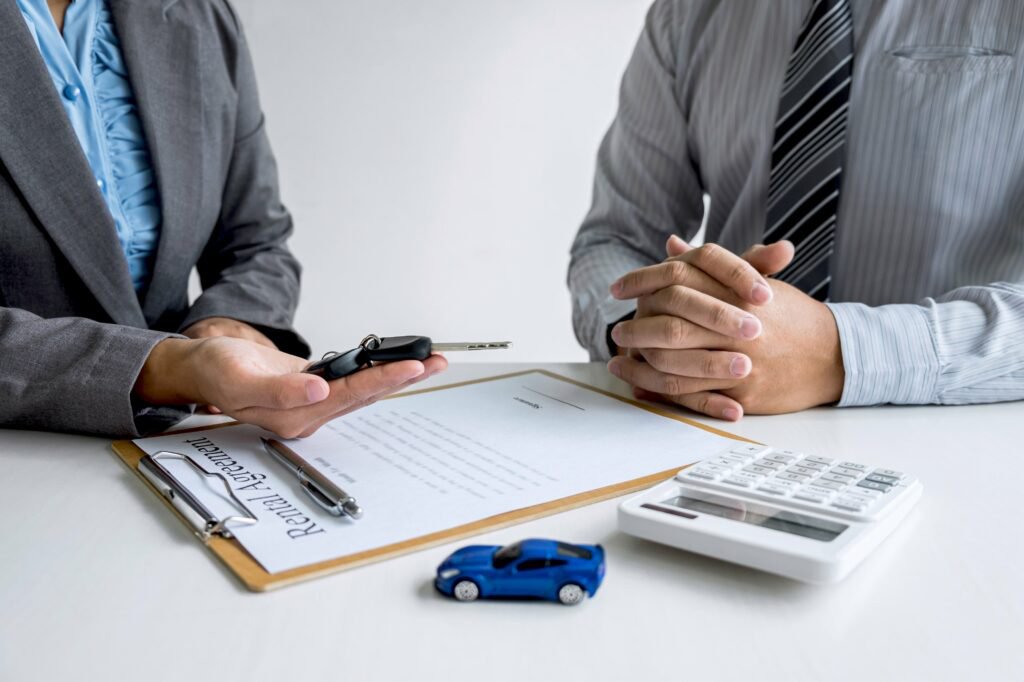 Bank loan paperwork showing selling a car under finance safely