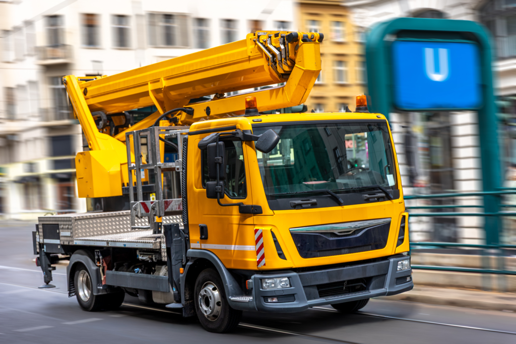 Professional towing truck loading an old junk vehicle