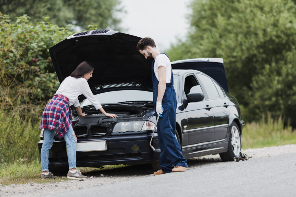 Professional tow truck loading a damaged vehicle to sell repairable write off car