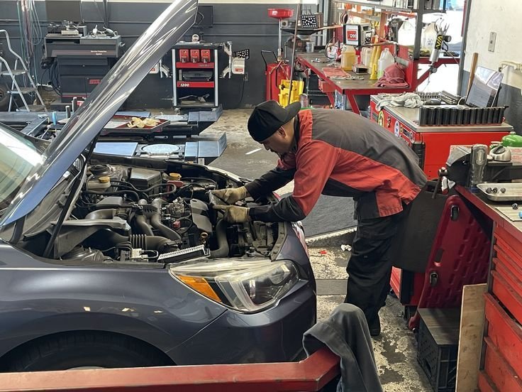 Professional mechanic inspecting a blown head gasket car safely