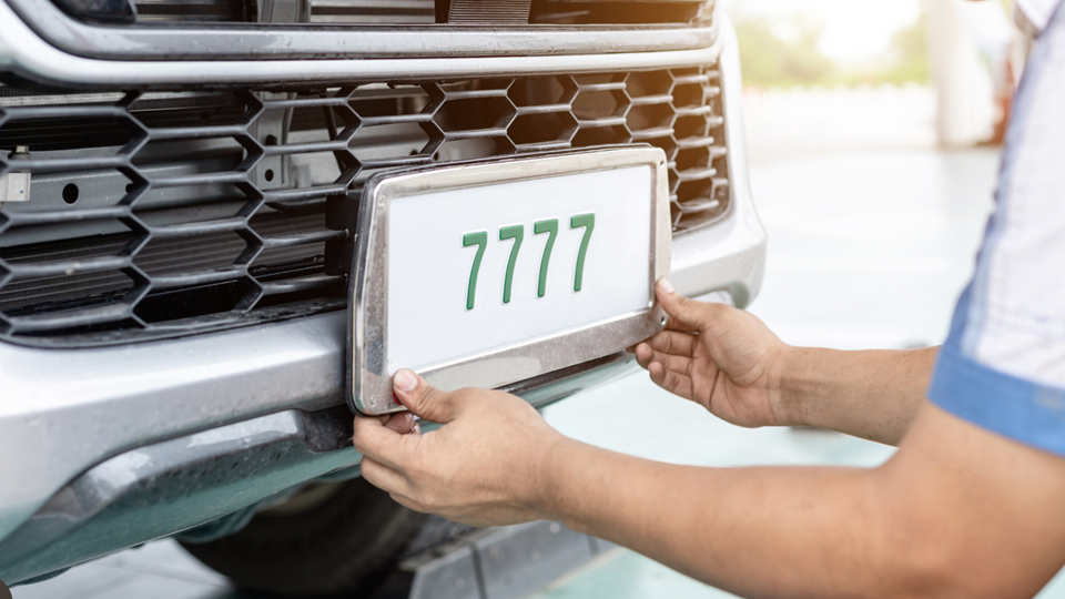 Professional buyer holding tools to surrender number plates vicroads safely