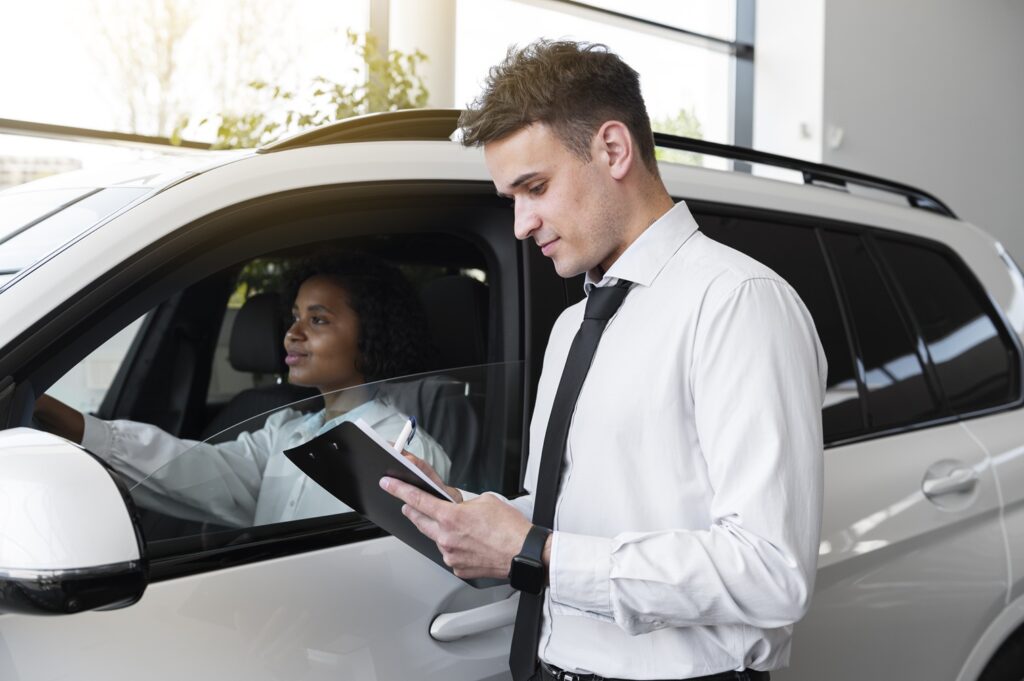 Professional auto appraiser calculating a true redbook car value safely